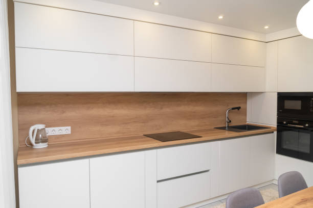 istock Modern minimalistic interior of a bright kitchen 1325878859