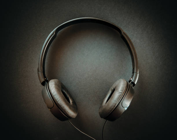 istock Headphones on a black background 1325879073