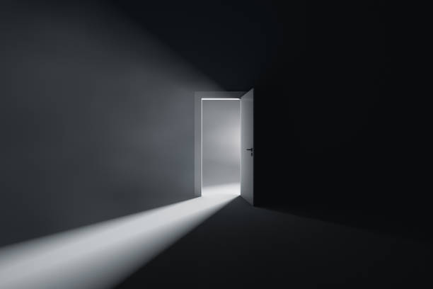 istock Open door to a room with bright light 1325880394