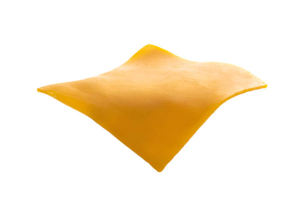 single cheddar cheese slice isolated on white - fat portion studio shot close up imagens e fotografias de stock