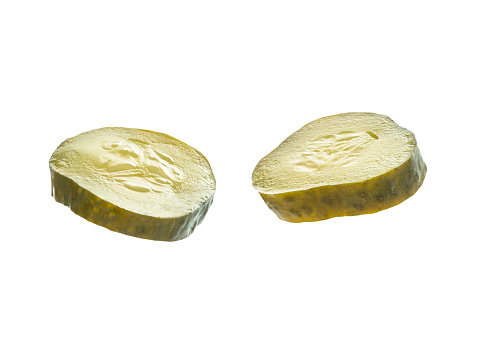 two slices of pickled cucumber gherkins picles isolated on white background