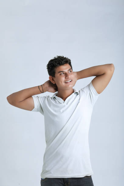 istock Young indian college student showing expression on white background 1325880752
