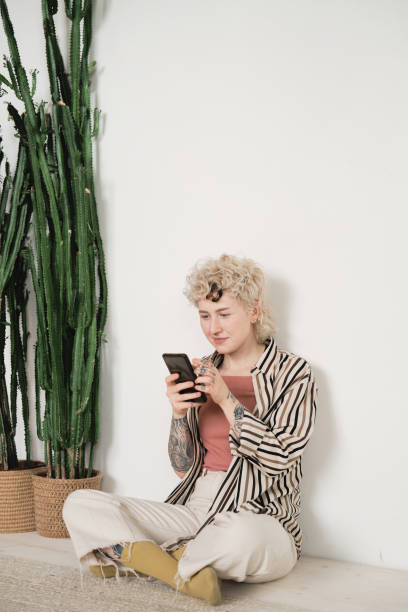 istock Woman reading a book online 1325882160