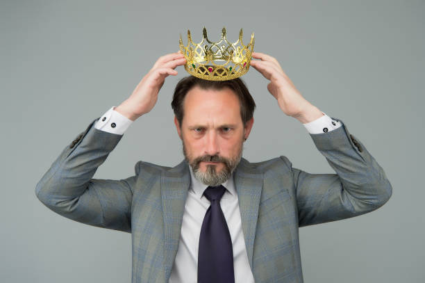 kill your pride before you lose your head. big boss wear crown with pride. proud businessman grey background. bearded man in formalwear. pride and egoism. pride and ambitions. toxic ego - vanity business business person men imagens e fotografias de stock