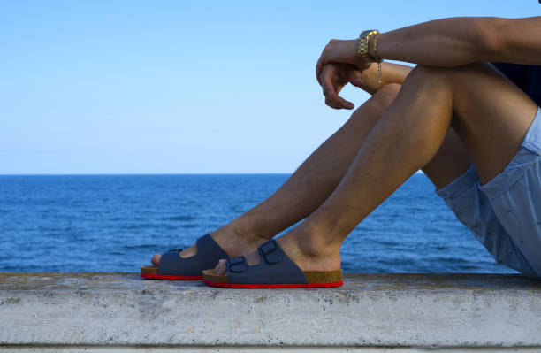 Beautiful red colorful children's shoes in the peas. lie on a white wooden floor in the corner of the frame