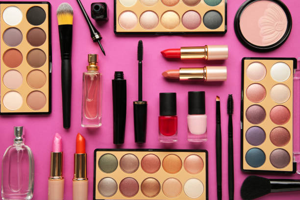 istock Different luxury makeup products on pink background, flat lay 1325884412