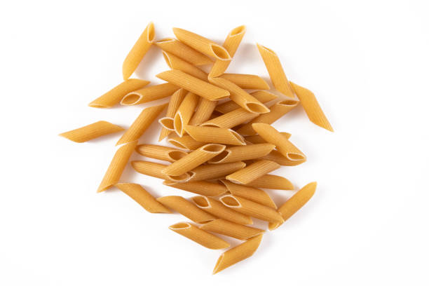 Heap of Italian pasta rigatoni in on white background