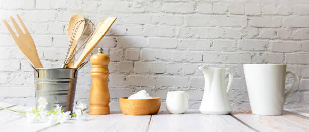 istock Kitchen tools and kitchenware utensil object with ingredients on kitchen shelf wood white for healthy eat and health care life.  Wall white brick background, copy space for text 1325888211