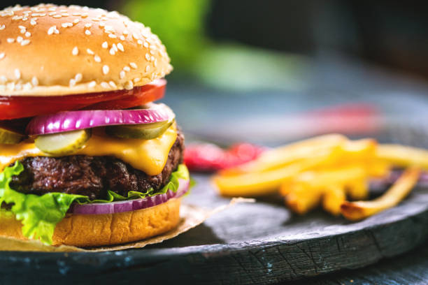 istock Delicious beef burger with french fries 1325889053