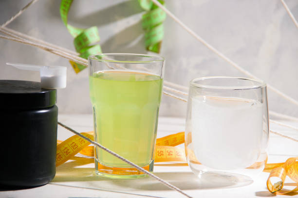 istock Sports drinks in glasses on a gray background. 1325889111