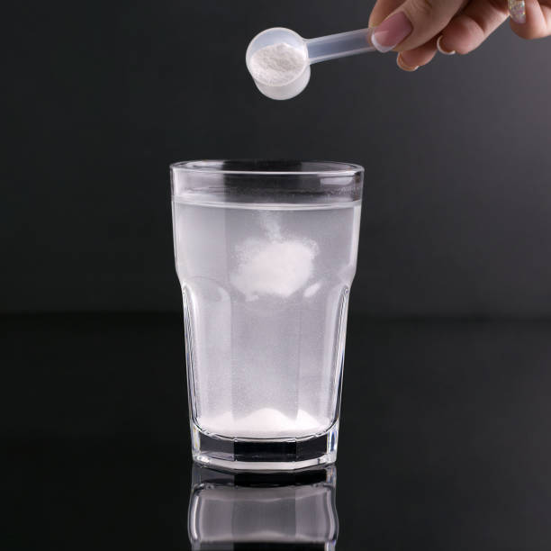 istock Fitness drink in a glass on a black background 1325889129