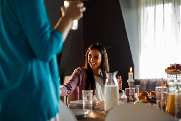 istock Young woman having a good time during brunch with friends 1325890084