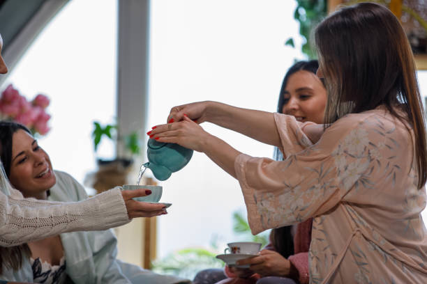 istock Pouring her friends some tea during a slumber party 1325891143
