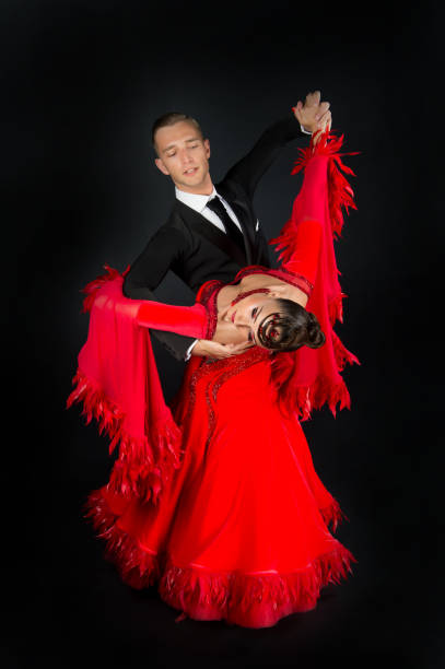 istock dance ballroom couple in a dance pose isolated on blackbackground 1325892008