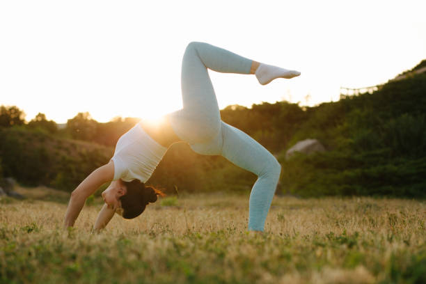 istock Glorious brunette woman relaxing in nature and practicing yoga in sunset. Space for text 1325896291