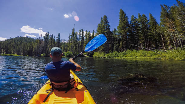istock Summer travel in USA: POV kayaking in lake recreational area 1325896771