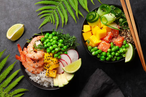 istock Poke bowls with shrimps, salmon, avocado and mango 1325896833