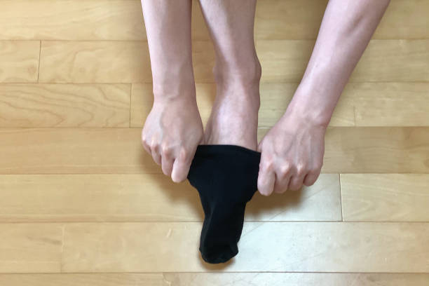 istock A man is wearing black socks 1325897370