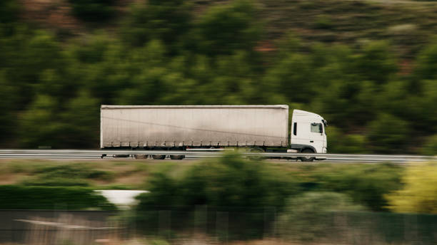 istock Trailer truck in motion 1325897857