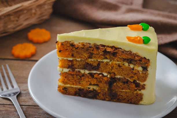 istock Slice of carrot cake on white plate 1325899674