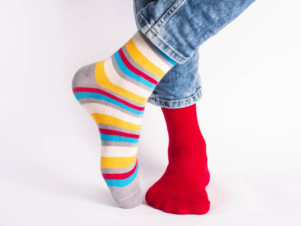 istock Men's legs and bright socks. Without shoes 1325902324