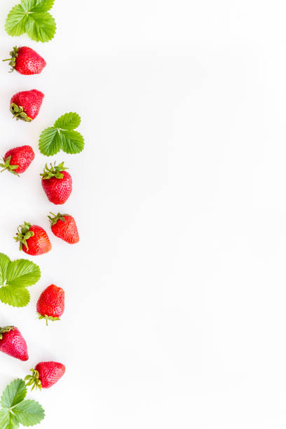 istock Red ripe strawberries with green leaves. Top view 1325903087