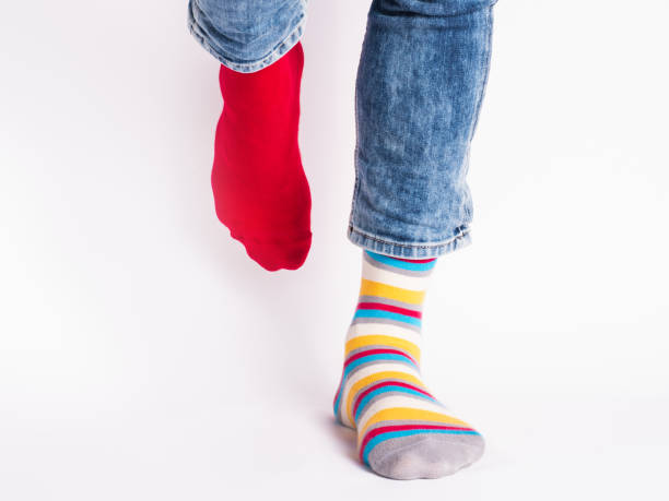 istock Men's legs and bright socks. Without shoes 1325903161
