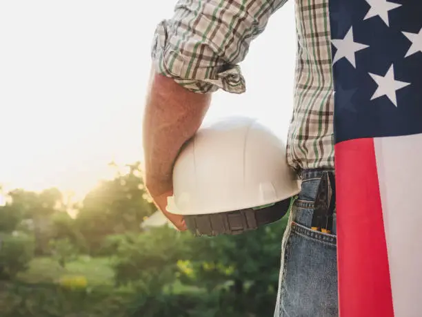 Photo of Attractive man holding tools in his hands