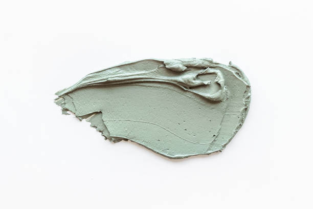 istock Cosmetic blue clay mask isolated on white background 1325903439