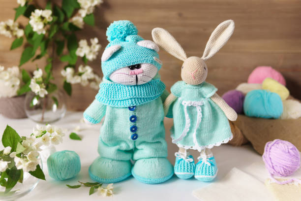 istock Toy knitted on wooden table. Crochet stuffed animals. 1325904591