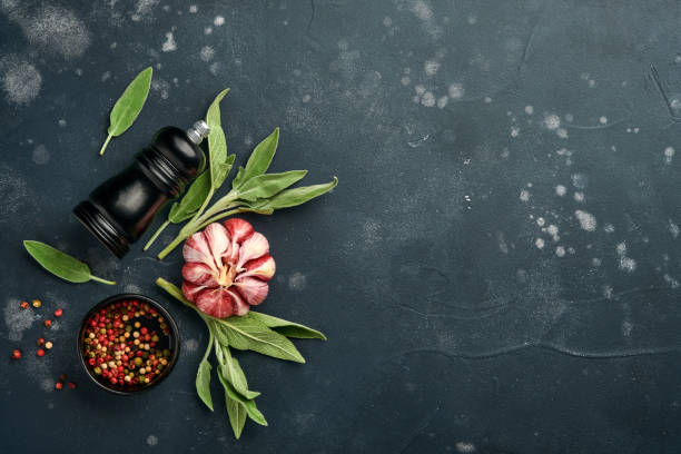 istock Food background. Spices, herbs, sage leaf, multicolored pepper and kitchen tools. Top view. Space for your text. Rustic style. 1325906004