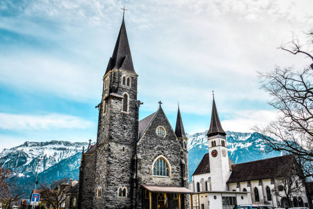 istock Low Angle View Of Protestant And Catholic Churches In Interlaken, Switzerland 1325906101