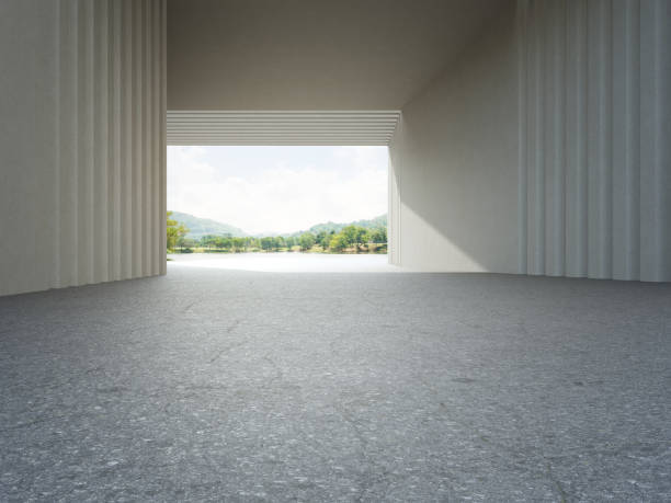 istock Abstract architecture design of modern building. Empty parking area floor and concrete wall with mountain and blue sky lake view. 1325907029