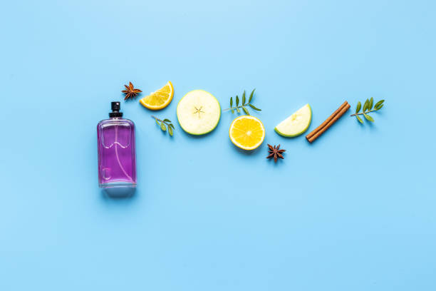 istock Perfume bottle flat lay with fragrance ingredients, top view 1325909656