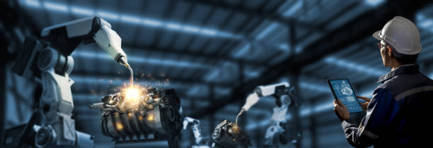 istock Engineer check and control welding robotics automatic arms machine in intelligent and  digital manufacturing operation on real time monitoring system software. Industrials 4.0 concept. Smart operation 1325911485