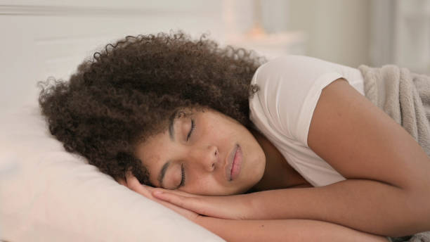 istock Peaceful Young African Woman Sleeping in Bed 1325916018