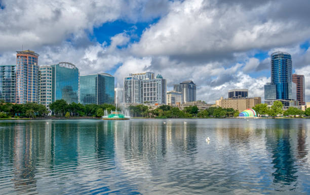 istock Orlando Florida Downtown Skyline During Summer Over Lake Eola Park 1325916198