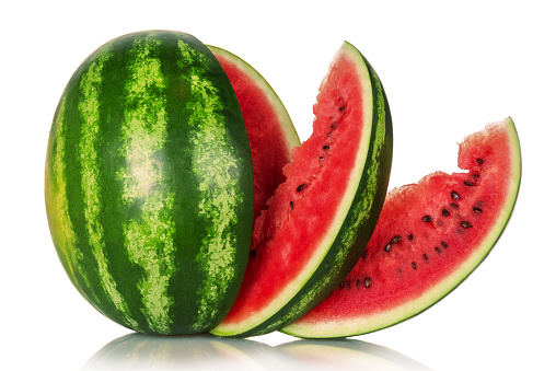 Juicy tasty watermelon and several slices isolated on white background