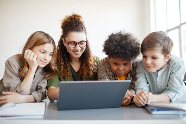 istock Kids with Teacher in Class 1325918662