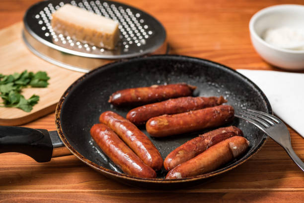 istock Sausages in frying pan 1325918730