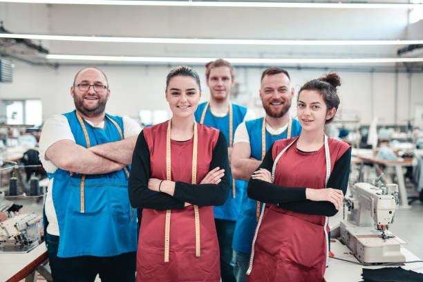 istock Successful Textile Factory Team Working Together 1325921057
