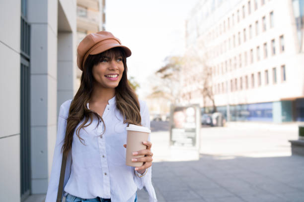 istock Young woman holding a cup of coffee. 1325921290