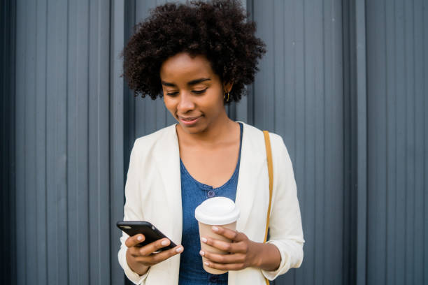 istock Business woman using her mobile phone outdoors. 1325922516