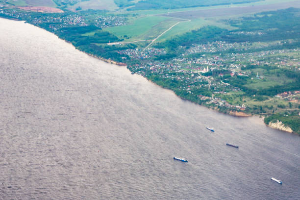 istock View from airplane on Earth surface - river. the Volga River 1325923103