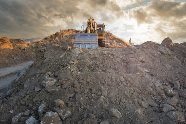 istock Excavator moving dirt and sand at a construction site 1325924403