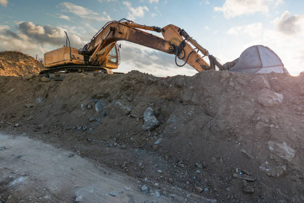 istock Excavator moving dirt and sand at a construction site 1325924405