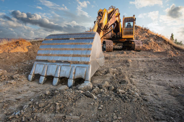 istock Excavator moving dirt and sand at a construction site 1325924406