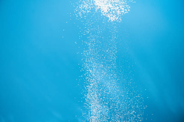 istock White powder splash isolated on blue background. Flour sifting on a blue background. Explosive powder white 1325924585