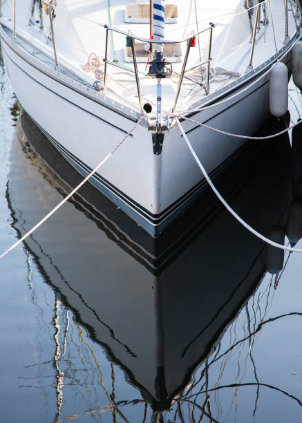 istock Boat hull at the port reflecting in the water 1325925849