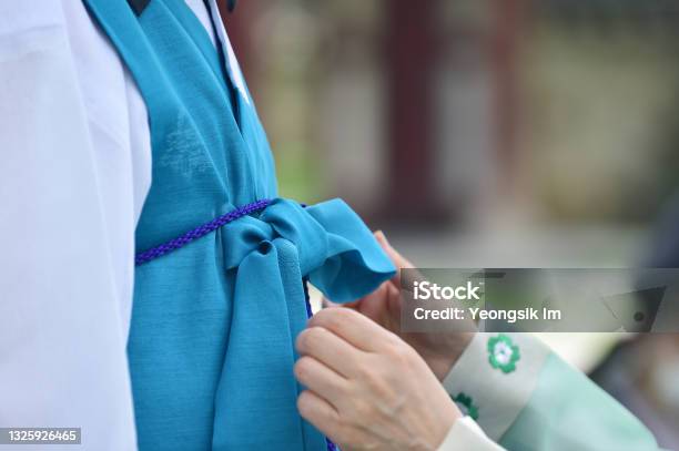 Tie A Coat String Of Hanbok Stock Photo - Download Image Now - Hanbok, Arts Culture and Entertainment, Breast